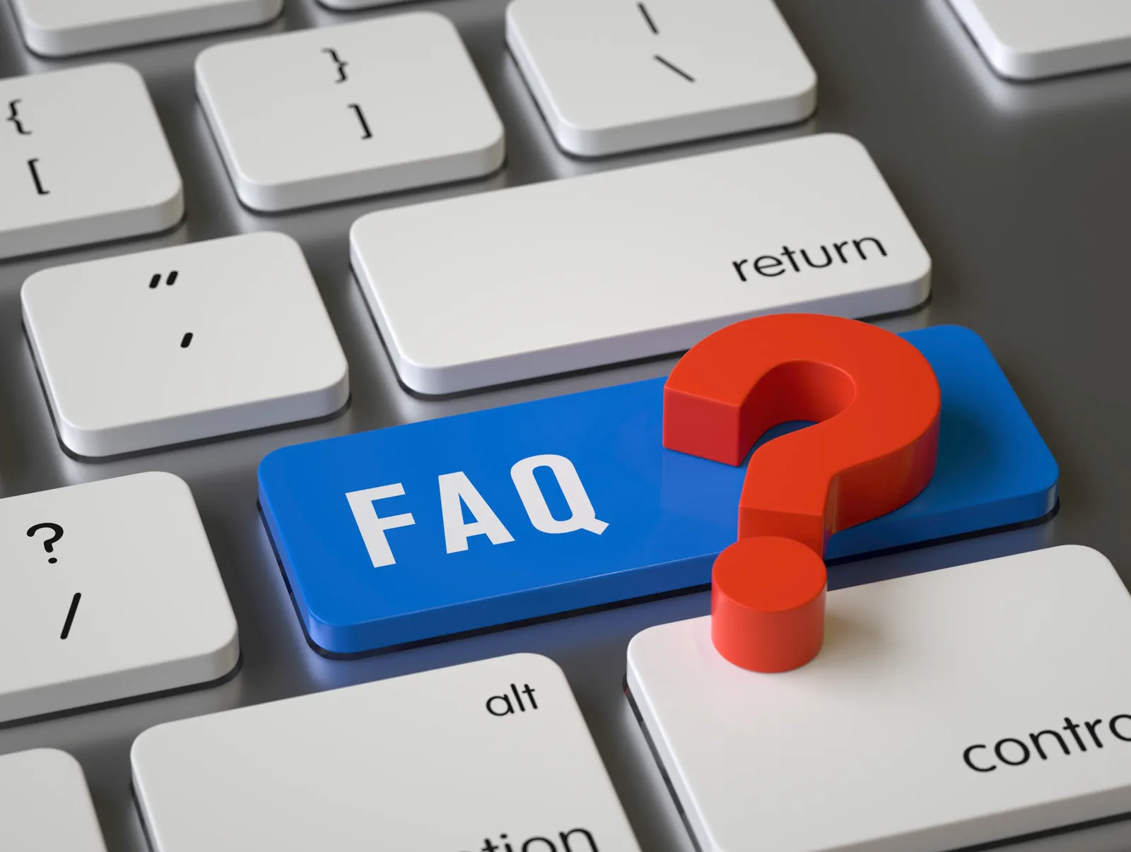 A keyboard with a highlighted FAQ key and a question mark, representing frequently asked questions.